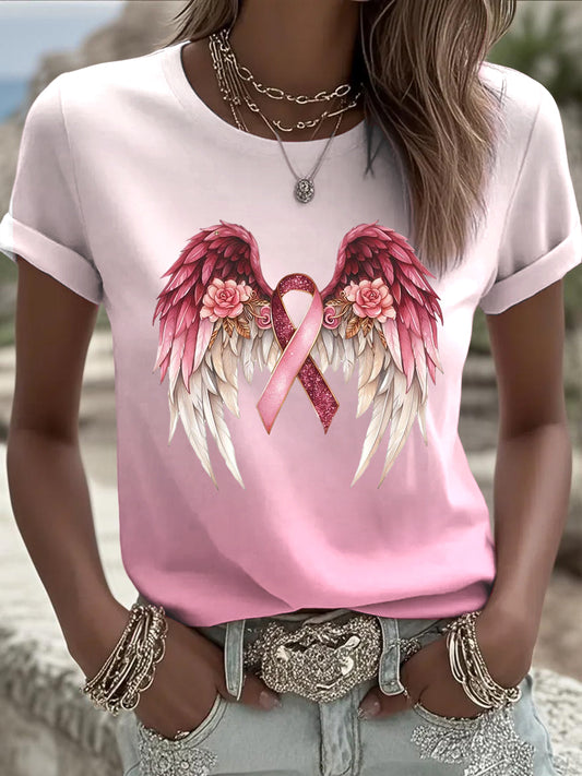 La camiseta rosada europea popular de las mujeres, adornada con la impresión hermosa de la cinta de la prevención del cáncer de pecho de las alas, es una opción de moda para el desgaste diario