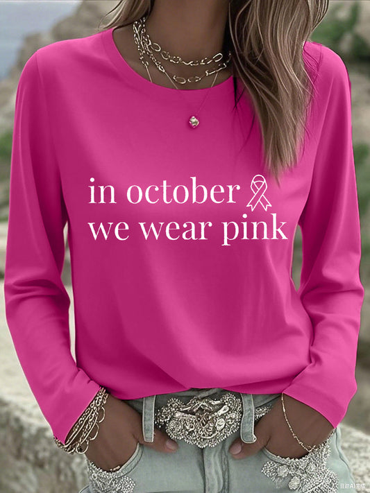 En octubre de las mujeres nos ponemos camiseta de manga larga rosada de la conciencia del cáncer de pecho